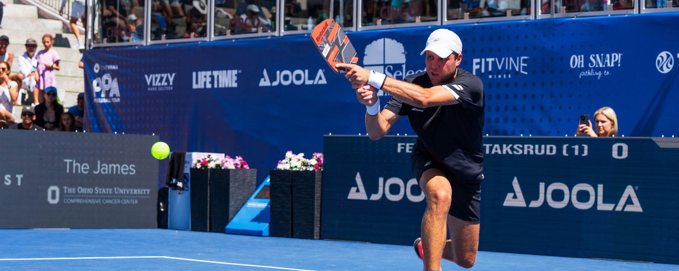 Chris Haworth hits a backhand.