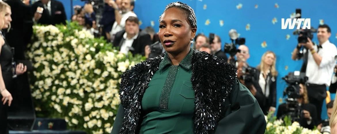 Venus Williams posing on the red carpet in a custom Lacoste outfit.