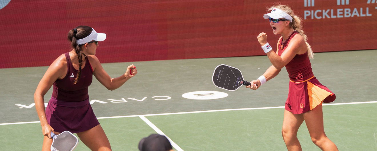 Anna Bright and Anna Leigh Waters fist pumping on court.