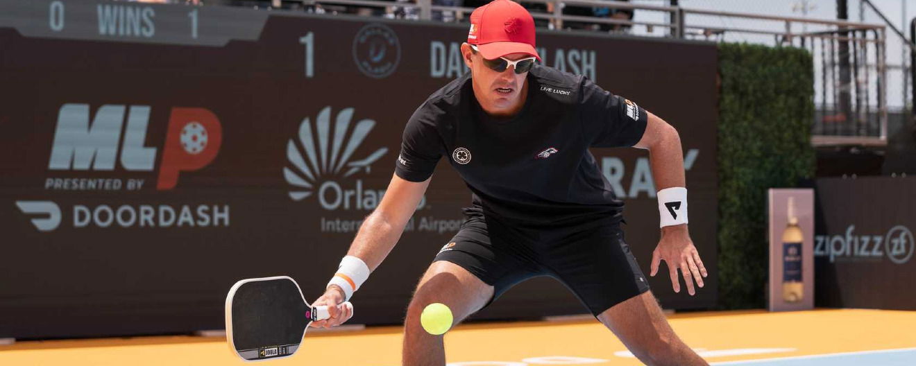 Collin Johns hits a pickleball forehand dink.