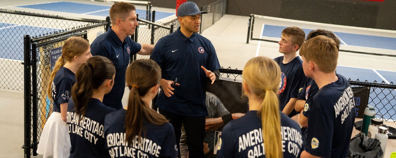A group of students receiving instructions.
