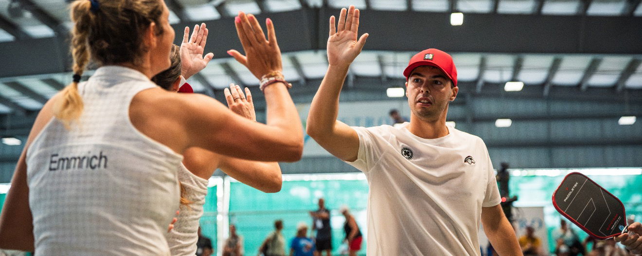 Ben Johns high-fiving his Carolina Hogs teammates.