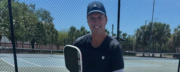 Tino Martinez posing with a JOOLA paddle.