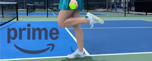 Woman standing on a pickleball court with Amazon Prime logo.