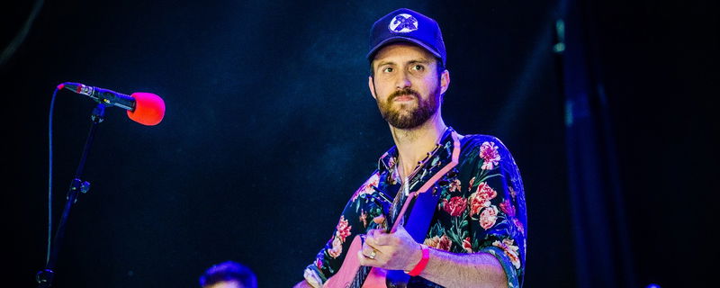 Ruston Kelly performing on stage.