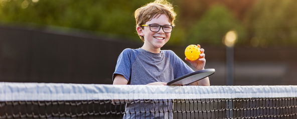 A child playing pickleball.