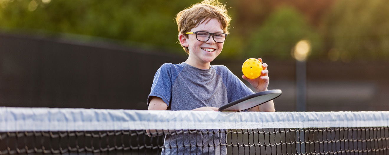 A child playing pickleball.