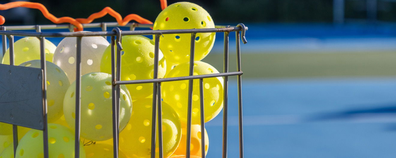 A collection of pickleballs.