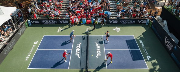 A pickleball court with players.