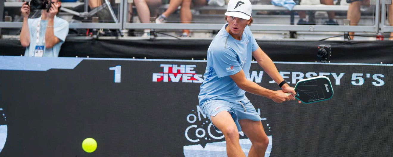 Hayden Patriquin hitting a backhand.