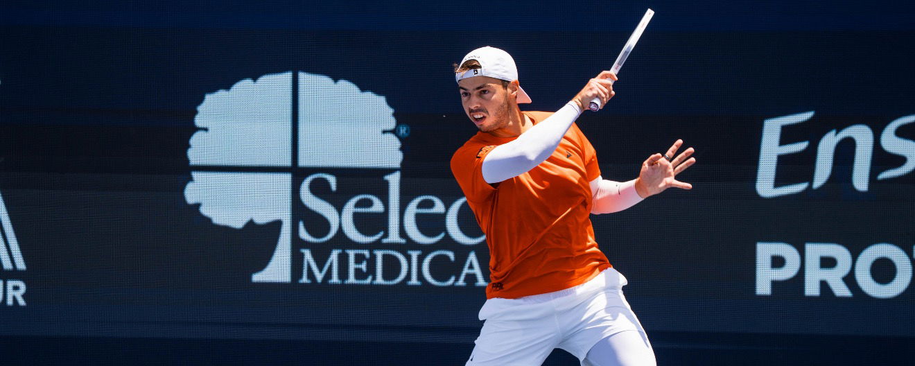 Ben Johns hitting a return.