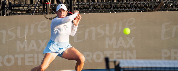 Brooke Buckner hitting a forehand.
