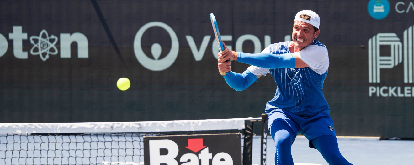 Andrei Daescu hitting a backhand.
