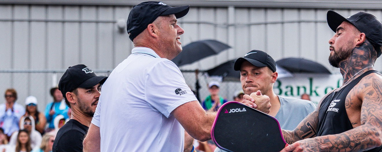 Matt Wright and Jaume Martinez Vich shake hands with Tyson McGuffin and Max Freeman after defeating them in the semifinal