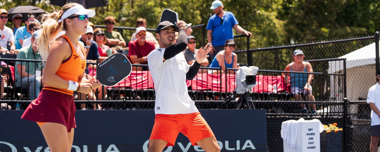 Anna Leigh Waters and Ben Johns competing on the court.