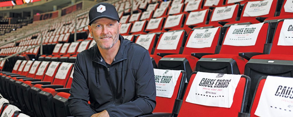 Tom Dundon sitting in the stands at Lenovo Center in Raleigh.