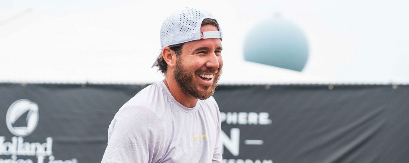 Thomas Wilson laughing on the pro pickleball court. 