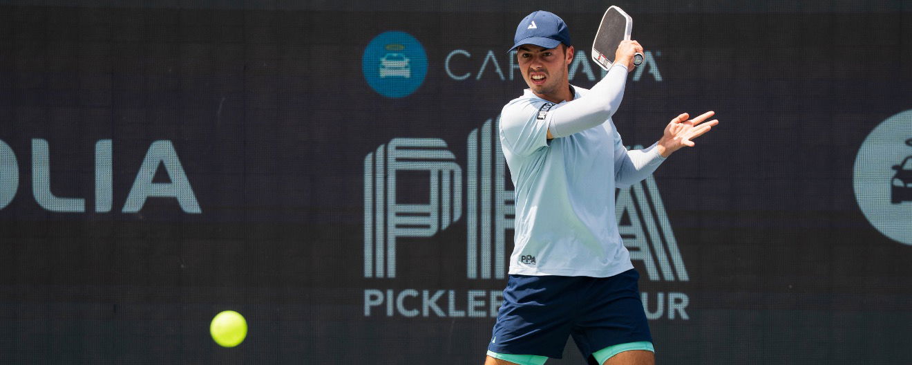 Ben Johns hitting a return.