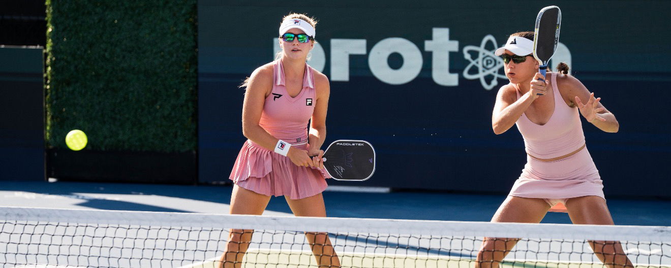 Anna Leigh Waters and Anna Bright competing on the court.