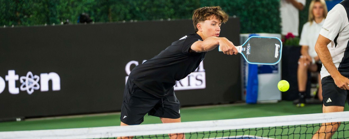 Hayden Patriquin hitting a backhand flick at the net. 