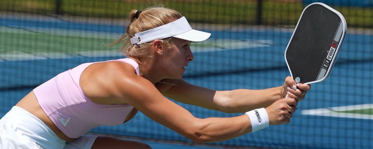 Hannah Blatt hitting a two-handed backhand on the court.