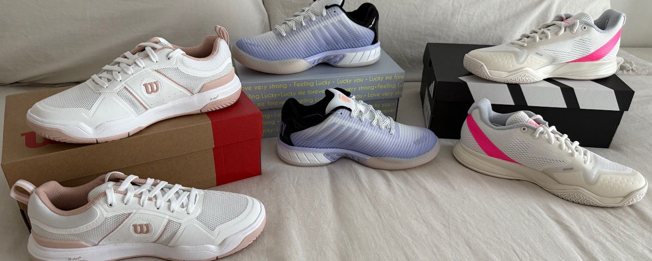 Three pairs of pickleball court shoes on display.