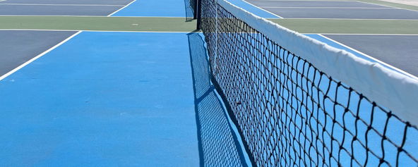 Close up image of a pickleball net.