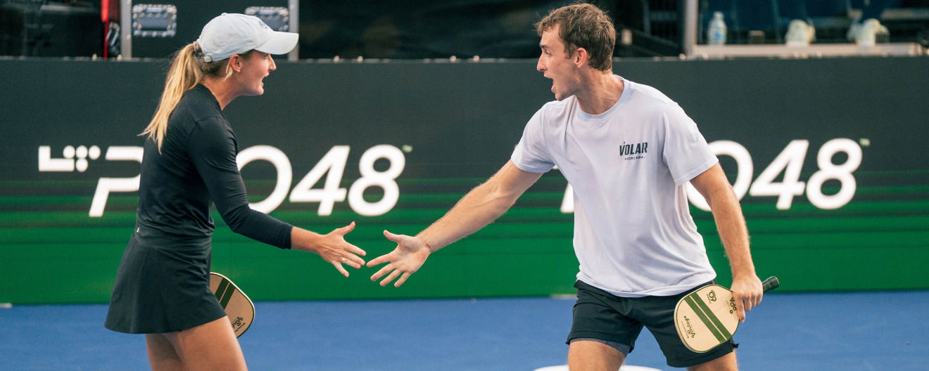 Kate Fahey and Dylan Frazier celebrating their victory at the Pickleball Central Sacramento Vintage Open.
