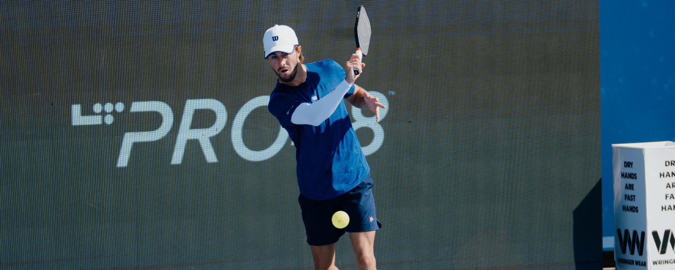 Hunter Johnson hitting a return.