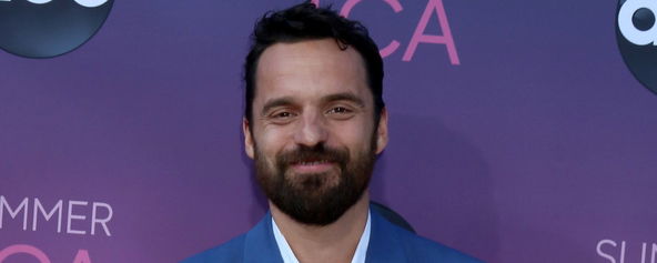 Jake Johnson smiling for the camera.