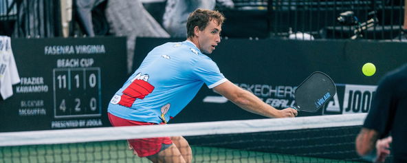 Dylan Frazier in a bright blue t-shirt with Snoopy on it