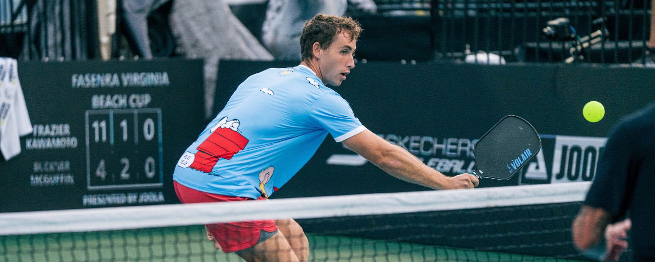 Dylan Frazier in a bright blue t-shirt with Snoopy on it