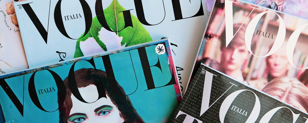 A pile of Vogue fashion magazine covers