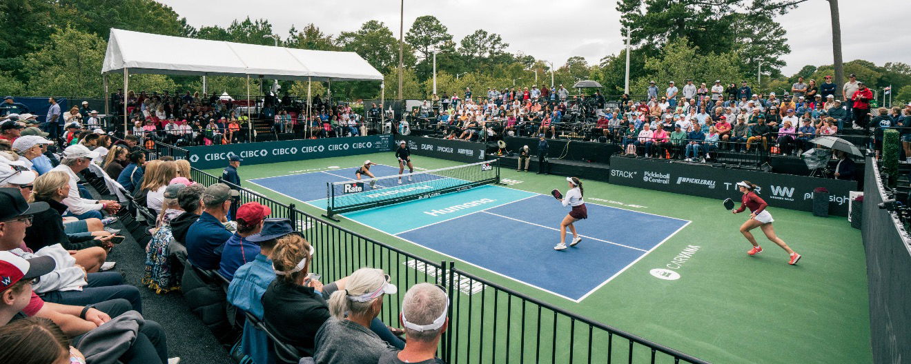 Players on a pickleball court.