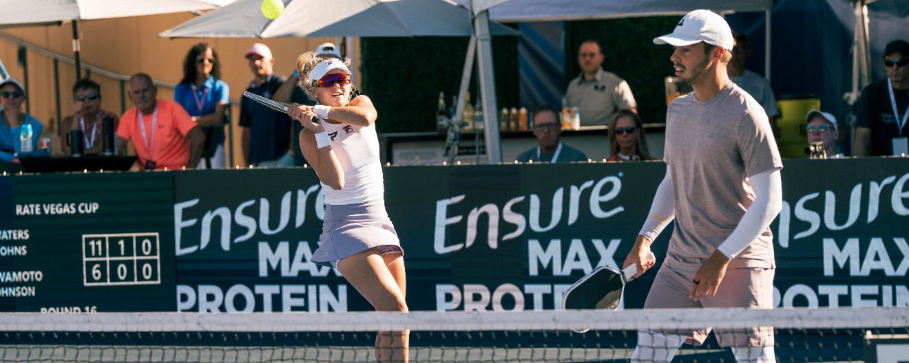 Anna Leigh Waters and Ben Johns swing away on the doubles court together