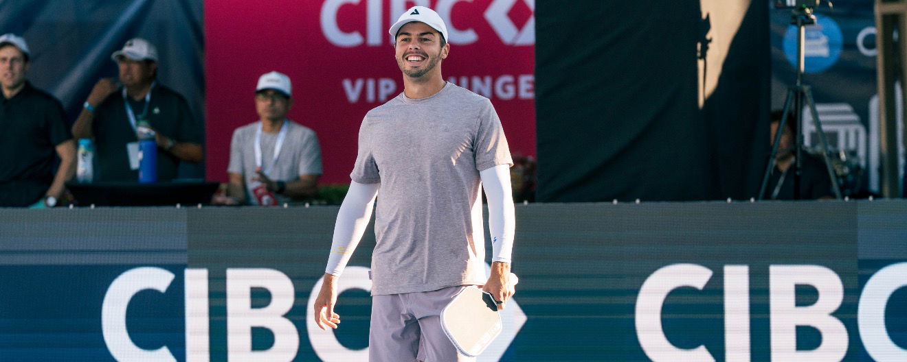Ben Johns smiling on the court.