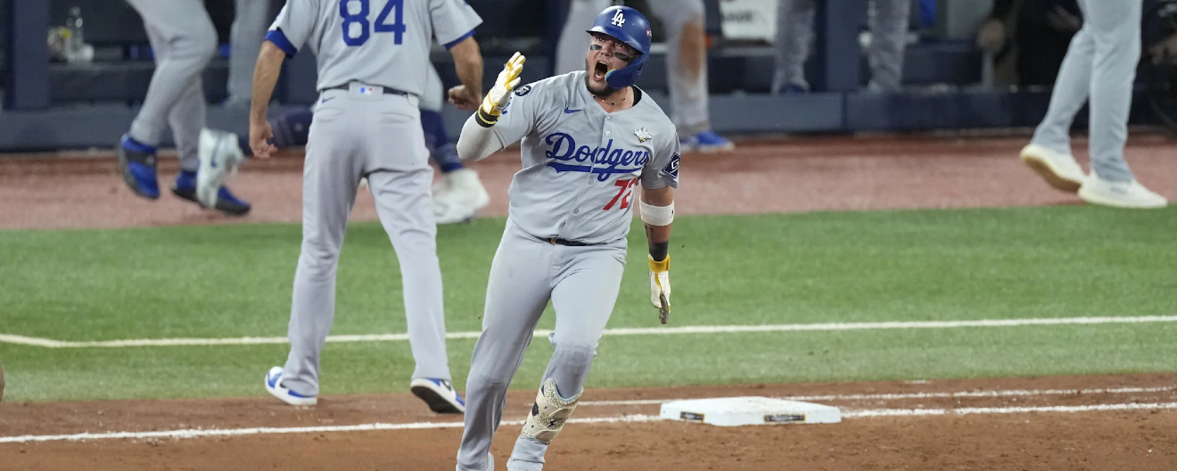 Los Angeles Dodgers player Miguel Rojas celebrates a home run in the World Series.