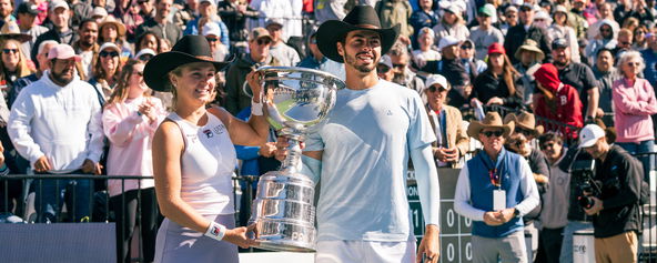 Anna Leigh Waters and Ben Johns with the trophy after their mixed doubles title.