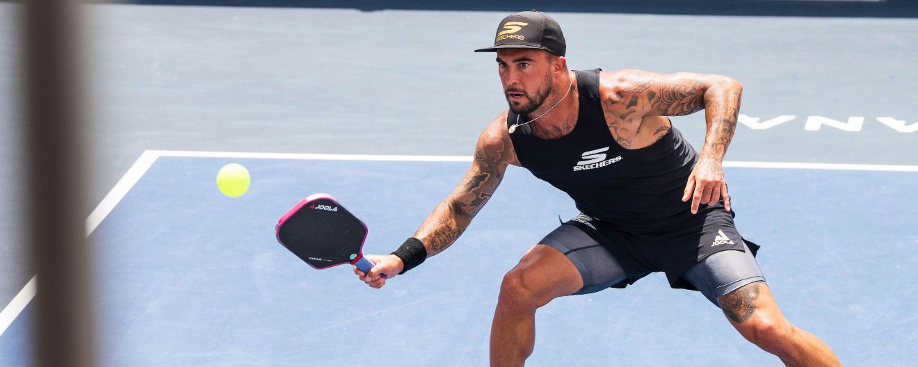 Tyson McGuffin playing preparing to return the ball.