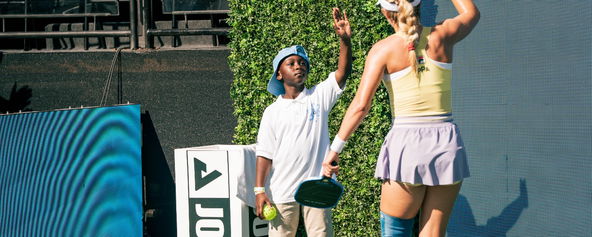 Micah Yeboah and Anna Leigh Waters exchange a high five at Worlds.