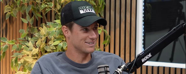 Roscoe Bellamy talking into a mic with a Pickleballers hat on.