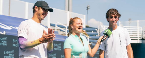 Michelle McMahon interviewing Ben Johns and Gabe Tardio during a tournament.