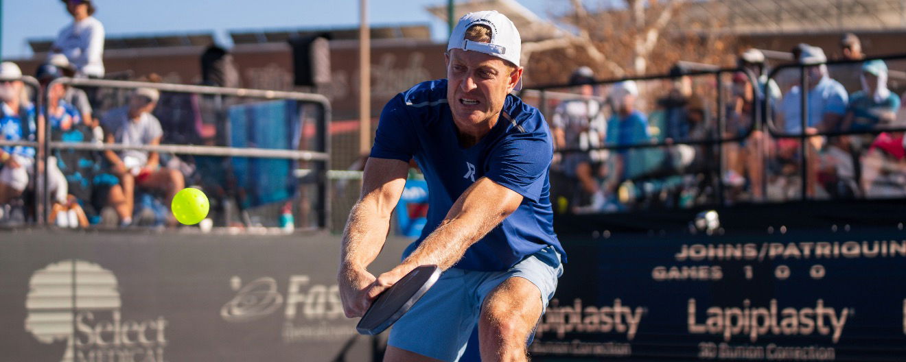Newman playing pickleball
