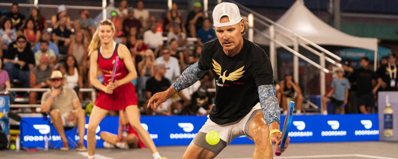 Eric Byrnes on the court with Genie Bouchard in Arizona.