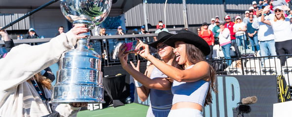 Anna Bright and Anna Leigh Waters taking a selfie with the trophy at the Jenius Bank Pickleball World Championships.
