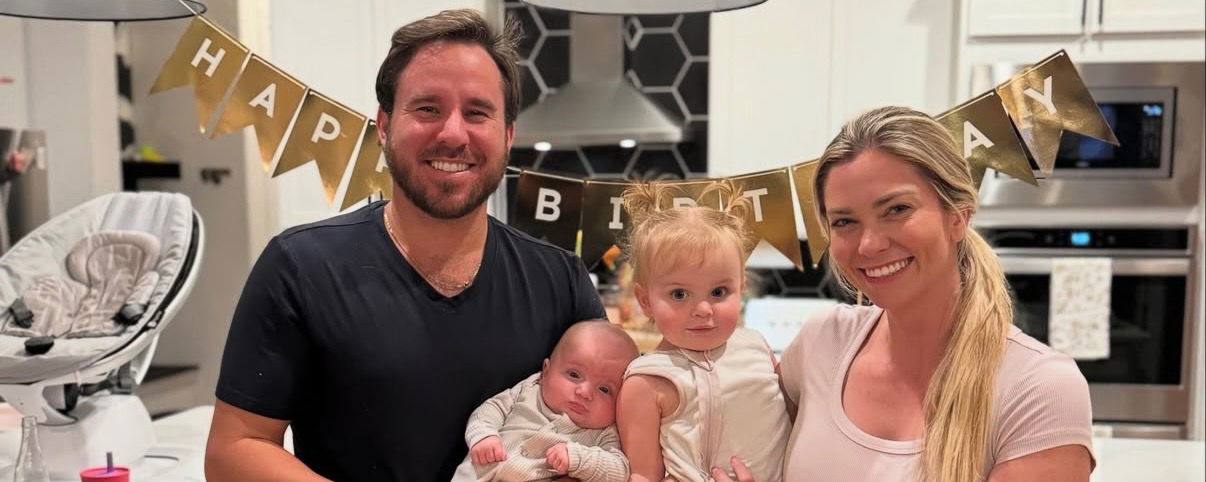 A family photo of Thomas Wilson, his wife, and daughters. 