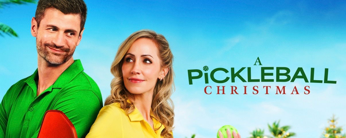 James Lafferty and Zibby Allen smiling and looking at each other.