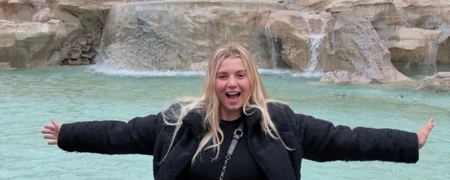 Anna Leigh Waters throwing her arms out wide.