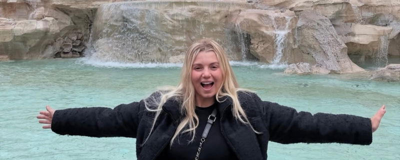 Anna Leigh Waters throwing her arms out wide.