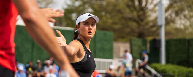 Anna Bright high-fiving her mixed doubles partner Federico Staksrud.